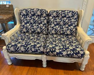 Distressed white love seat