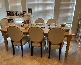 Pier 1 farmhouse dining table and 8 padded shield-back chairs