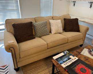 Nail head-trimmed sofa w/pillows