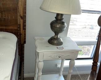 A pair of these "shabby chic" bedside stands