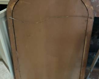 Vintage gold tone mirror with floral accents. Note glass was likely replaced, it is not beveled. Hanging hardware is installed.  Measures 25 x 36.  --- $80