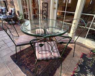 Metal & Glass Top Table and 4 Chairs. Table measures 36 round, 30h.  No chips or cracks in glass. Very good condition. --- $180