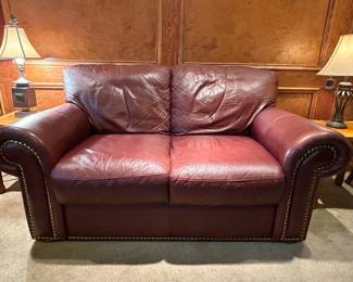 Leather loveseat. In great condition with a lot of life left in it. Measures 64w 36d 32h --- $200