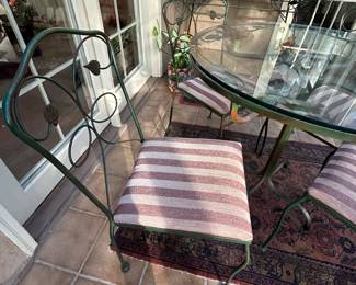 Metal & Glass Top Table and 4 Chairs. Table measures 36 round, 30h.  No chips or cracks in glass. Very good condition. --- $180
