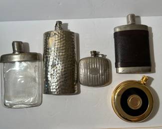 Lot of 5 vintage flasks. Four are marked “Germany.”  Gold tone one has no markings.  —-$75