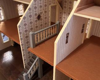 Very large vintage dollhouse beautifully crafted; on rolling wooden platform.  Measurement includes the platform. Measures 50w 30d 38h. --- $350