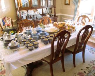 A gorgeous dining table that seats six currently has an oversized leaf that can break down smaller but also serve the biggest events.