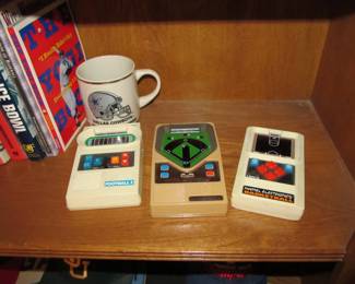 We have an incredible sports memorabilia collection that includes books, bobbleheads, sports banners, commemorative drinks, vintage sports games, & hats.