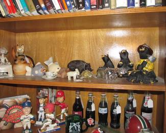 We have an incredible sports memorabilia collection that includes books, bobbleheads, sports banners, commemorative drinks, vintage sports games, & hats.