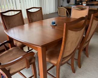 Dining room table with two extra leaves and 8 chairs. Made in Canada.
