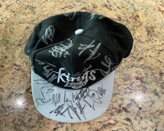 Los Angeles Kings Cap with Team Signature, the owner of this cap was said to have been in a sports bar when the team came in after a game. Included among the Signatures is Wayne Gretzky although we are not sure which signature is his