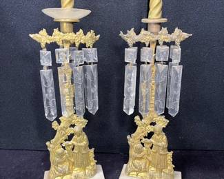 Pair of Mid 19th Century Gilt Metal Candle Holders Etched crystal prisms hang above a young woman, lamb and a young boy.  Some people describe these as Girandoles, they are on a marble base.  Likely either French or Italian.  Appear to be Rococo Revival.
