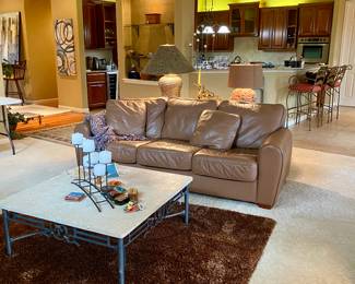 Welcome to the lovely living room, leather sofa, matching travertine stone table set, two reading chairs 