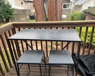 $460 three pieces and protective cover.  Room & Board Slim Outdoor table in graphite.  48"w x 24"d x35"h.  With two matching stools.  No longer available is this height online.  Originally $980.