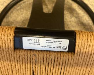 base of chair showing designer name