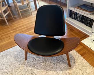 $1900. DWR Shell leather and walnut chair by Carl Hansen & Son.  36"w x 31"d x 29.5"h.  Currently online for $5255 plus tax and shipping.