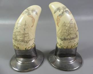 Pair whale teeth on silver stands