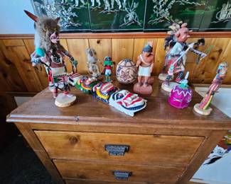 Kachinas and an antique 3 drawer chest.