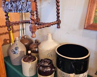 Old crocks and jugs; an antique carved wood barley twist chair.