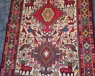 Persian rug with animals 55 x 46".