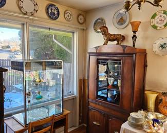 Wonderful lighted Swarovski showcase atop a vintage school desk with chair.