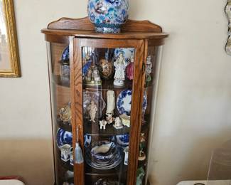 Oak cabinet containing antique china and figurines, a fine cloisonné vase.