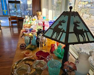 Tables with assorted glassware.