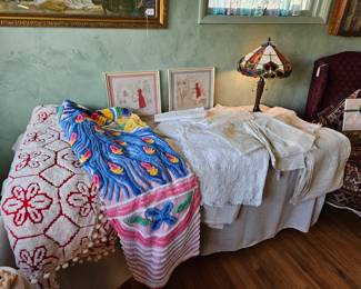 Vintage chenille bedspreads in excellent condition. Fine linens, framed 'Little Red Riding Hood' hankies, Tiffany style table lamp.