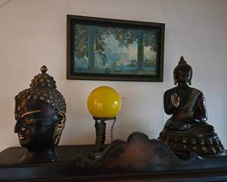 Large bronze Buddah, an Art Deco ball on stand, another bronze Buddah.