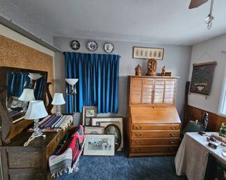 Antique oak dresser with mirror, Secretary bookcase and various artwork.
