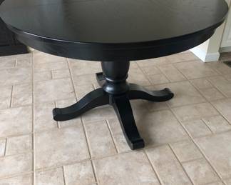 BLACK ROUND TABLE WITH ONE LEFT BY CRATE AND BARREL