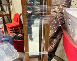 Lighted curio cabinet, with glass shelves.