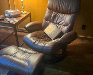 4 leather recliners with footstools