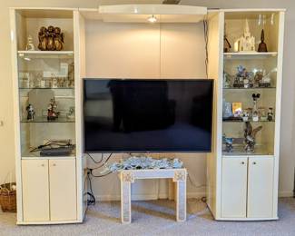 Saturday's Price = $75.00 - Cream Lacquer Entertainment Center.  Travertine Look.  78.5" tall, 97" wide, each cabinet is 23" wide and 18.24" deep, the space between cabinets is 50" .