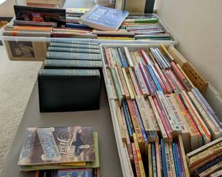 Two of three tables of books - hardbacks $3 / paperbacks $1.