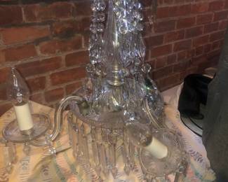 CLOSE UP VIEW OF RARE ANTIQUE WATERFORD CRYSTAL CHANDELIER WITH ALL OF THE PRISMS ACCOUNTED FOR.
