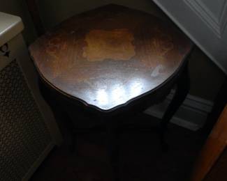 Antique table with inlaid wood