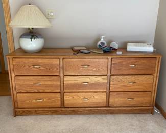 SOLD ……9 Drawer Oak Dresser.    Measurements: 67” W x 18 1/4” D x 29” H.  It does have a few water marks please see following photo.