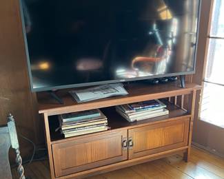 Large screen TV and entertainment cabinet