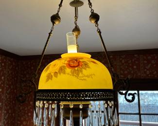 Antique oil lamp, converted to electric use, hand painted glass shade a d prism drops. 