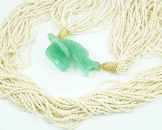 Jade horse pendant with multi-strand pearl necklace