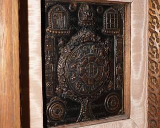 Bronze relief Asian calendar