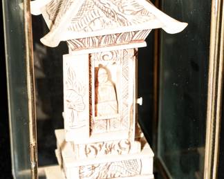 Vintage carved pagoda with Buddha