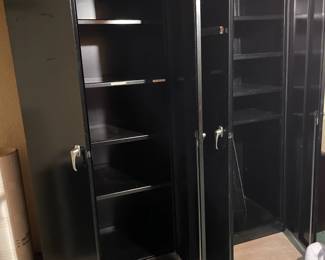 . . . two of three metal storage cabinets