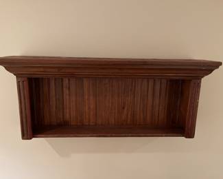 Interesting wood wall shelf.