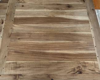 Close-up view of surface of Scandinavian-style dining table.