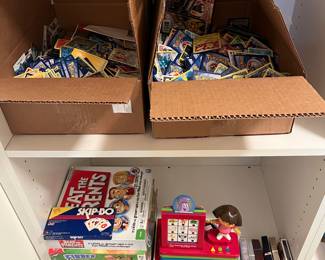 Two boxes of Pokémon cards; games and toys.