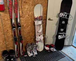 Margaret snowboard with Burton bindings (right in photo); burton Feelgood Smalls snowboard with Burton bindings (center); Elan eFlex 4 snow skis (left).