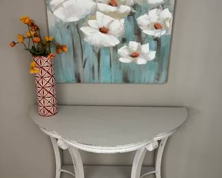 Shabby chic half-moon table; fun, quality art and decor throughout the house.