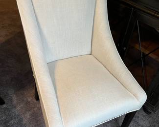 Close-up view of one of the four matching upholstered chairs shown in preceding photo.